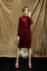 Velvet midi dress with lace trim, high neckline, and long sleeves for elegant occasions