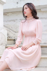 Silk midi dress with ruffle neckline and smocked cuffs for a romantic vintage-inspired look