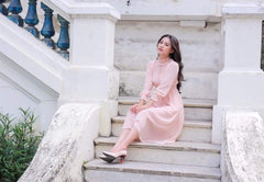 Silk midi dress with ruffle neckline and smocked cuffs for a romantic vintage-inspired look