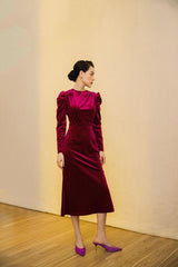 Velvet midi dress with ruched shoulders and long sleeves for elegant evening occasions