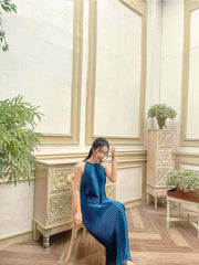 Pleated silk midi dress with halter neckline and soft flowing A-line silhouette