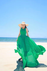 Robe longue fluide en lin avec dos croisé et jupe à volants pour un style estival sans effort