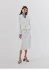 Blazer en lin boutonné à col en V et poches pour femme