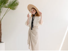 Jupe portefeuille mi-longue taille haute en lin doux