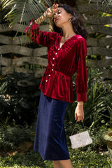 Pleated velvet midi skirt with soft flare and structured drape for elegant seasonal styling