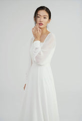 Elegant long-sleeve organza dress with square neckline and delicate textured bodice