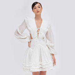 Tiered ruffle mini dress in sheer organza with balloon sleeves and open back tie detail