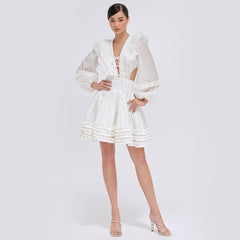 Tiered ruffle mini dress in sheer organza with balloon sleeves and open back tie detail