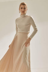 High-waisted pleated A-line skirt in flowing silk with structured waistband detail