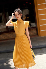 Short sleeve button-down silk blouse with pleated ruffle trim and structured collar