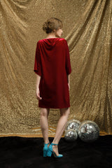 Velvet shift dress with oversized bow detail and relaxed sleeves for festive party looks