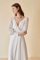 Silk maxi dress with sheer long sleeves and pleated wrap front for timeless elegance